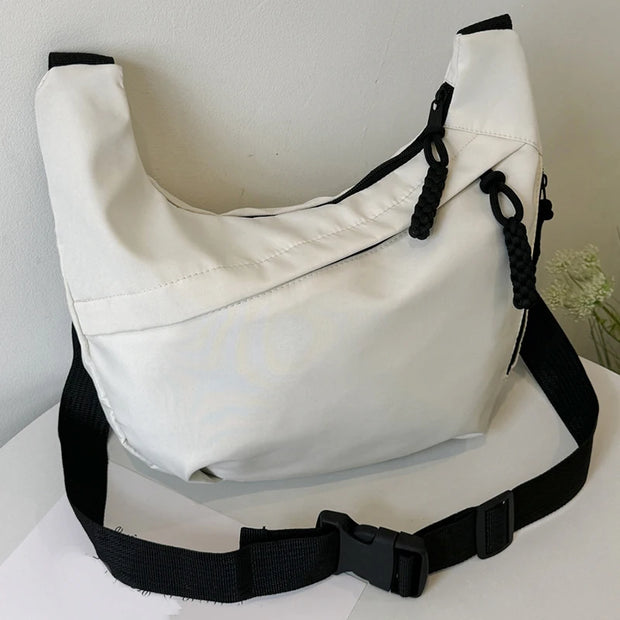 Neutral style tote bag with strap for carrying fitness items.
