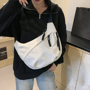 Neutral style tote bag with strap for carrying fitness items.
