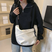 Neutral style tote bag with strap for carrying fitness items.